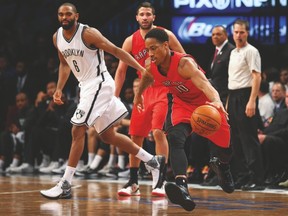 Raptors guard DeMar DeRozan handles the ball during last night’s game against the Nets in Brooklyn. (USA TODAY SPORTS)