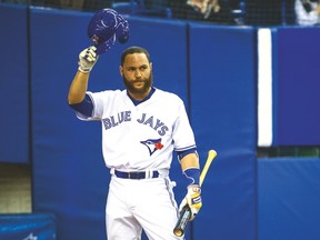 Jays catcher Russell Martin tips his hat to the crowd during last night’s game in Montreal. (QMI AGENCY)