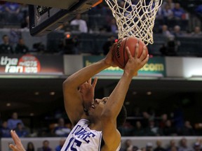 Duke Blue Devils centre Jahlil Okafor (15) drives to the basket during the first half against the Michigan State Spartans at Bankers Life Fieldhouse in November, 2014. (Pat Lovell-USA TODAY Sports)