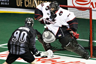 Edmonton's Ben McIntosh takes a shot on Vancouver's Eric Penney during the Edmonton Rush's NLL lacrosse game against the Vancouver Stealth at Rexall Place in Edmonton, Alta., on Friday, April 3, 2015. Codie McLachlan/Edmonton Sun/QMI Agency