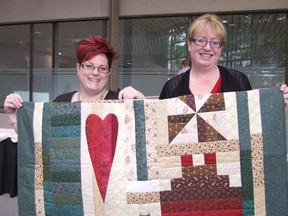 Carol Mulligan/The Sudbury Star
Monica Dorion (left) and Barbara Henderson say the House of Kin offers creature comforts such as blankets and quilts handmade by guests. Many quilts and blankets were sold in a silent auction at the Comforts of Home Luncheon.