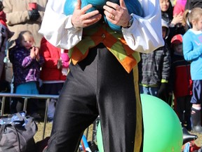 Jonathan Seglins juggles bowling balls during his Circus show in Canatara Park during Easter in the Park on Saturday April 4, 2015 in Sarnia, Ont. Paul Morden/Sarnia Observer/QMI Agency