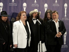 Members of the band Lynyrd Skynyrd (L-R) Gary Rossington, Billy Powell, Artimus Pyle, Bob Burns, and Ed King pose backstage at the Rock and Roll Hall of Fame induction ceremony at the Waldorf Astoria Hotel in New York in this March 13, 2006 file photo. REUTERS/Brendan McDermid/Files