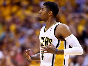 Paul George of the Indiana Pacers reacts against the Miami Heat during Game 5 of the Eastern Conference finals of the 2014 NBA playoffs at Bankers Life Fieldhouse on May 28, 2014. (Andy Lyons/Getty Images/AFP)