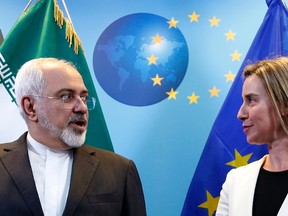 European Union foreign policy chief Federica Mogherini poses with Iranian Foreign Minister Mohammad Javad Zarif (L) ahead of nuclear talks in Brussels March 16, 2015.   REUTERS/Francois Lenoir