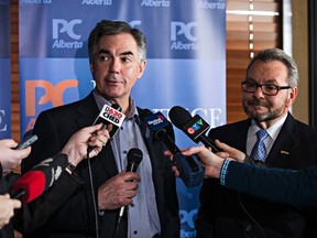 Alberta Premier Jim Prentice, left, and former city councillor Tony Caterina, right, announce Caterina's candidacy to run for the Progressive Conservatives in the next election for the riding of Edmonton-Beverly-Clareview at the Boston Pizza on 33 Street and 118 Avenue in Edmonton, Alta., on Thursday, April 2, 2015. Codie McLachlan/Edmonton Sun/QMI Agency