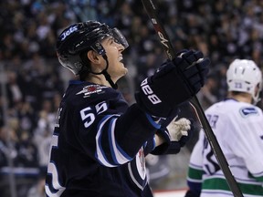 Mark Scheifele celebrates his goal during second period action in an NHL game against the Vancouver Canucks at the MTS Centre on April 4, 2015.