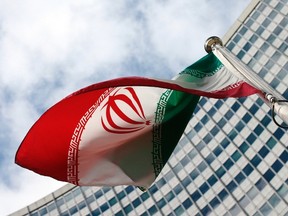 An Iranian flag flutters in front of the United Nations headquarters, during an International Atomic Energy Agency (IAEA) board of governors meeting, in Vienna, March 4, 2015. REUTERS/Heinz-Peter Bader