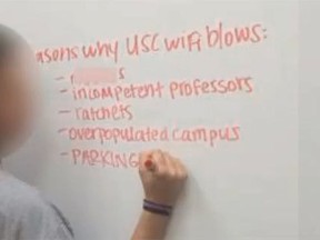 A photo circulating on social media sites on Saturday showed a woman compiling a list of factors deemed to cause poor wireless service on campus. At the top of the list was a derogatory term describing blacks. (wistv.com screengrab)