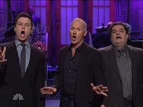 Taran Killam, Michael Keaton and Bobby Moynihan sing during last night's episode of Saturday Night Live.