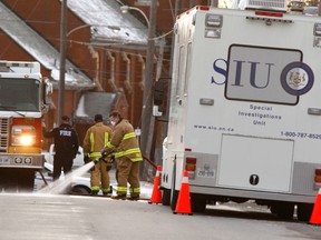 The province's Special Investigations Unit has been called in after a man died and a police officer was injured on Wolfe St., in Peterborough, Ont., on Sunday, April 5, 2015. (Clifford Skarstedt/QMI Agency)