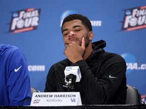 Andrew Harrison #5 of the Kentucky Wildcats reacts in the post game press conference after being defeated by the Wisconsin Badgers during the NCAA Men's Final Four Semifinal at Lucas Oil Stadium on April 4, 2015 in Indianapolis, Indiana. Wisconsin defeated Kentucky 71-64.  Joe Robbins/Getty Images/AFP
