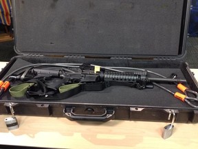 Calgary police display the rifle taken from an off-duty member's personal car on April 4, 2015. Michael Platt/Calgary Sun