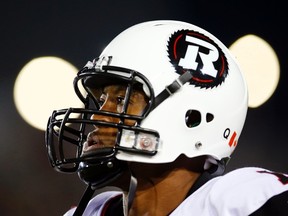 Ottawa Redblacks' quarterback Henry Burris looks on as his team plays the Hamilton Tiger-Cats during the first half of their CFL football in Hamilton, October 17, 2014. (REUTERS)