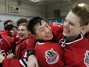 Tyler Ho (left) and Jackson Leppard of the North Shore Winterhawks (British Columbia) celebrate a 6-0 win over the Rocky Mountain Raiders (Alberta) in the final of the 2015 Western Canada Bantam Championships at St. James Civic Centre on Sun., April 5, 2015. (Kevin King/Winnipeg Sun/QMI Agency)