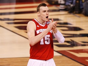 Wisconsin’s Sam Dekker (below) celebrates after the Badgers knocked off the undefeated Kentucky Wildcats on Saturday night. (USA Today)