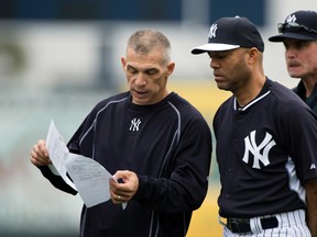 New York Yankees manager Joe Girardi (28) speaks with guest instructor Mariano Rivera during morning workouts at George M. Steinbrenner Field on Feb. 25, 2015. (TOMMY GILLIGAN/USA TODAY Sports)