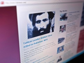 The Tolonews website runs a story on its front page reporting about the news of the death of Taliban leader Mullah Mohammad Omar in Kabulin this May 23, 2011, file photo. (REUTERS/Ahmad Masood/Files)