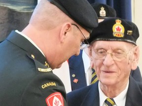 A medal is pinned to Ted Paisley’s lapel during a ceremony at the Royal Canadian Legion hall in Petrolia. Paisley was awarded the French Legion of Honour Medal for his efforts in liberating France over 70 years ago. (BRENT BOLES, QMI Agency)