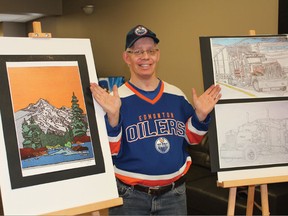 Artist Ian McLeish with two pieces of artwork from his collection at the Beehive Charity silent and live auctions. He is self-taught and enjoys most types of creative media.
