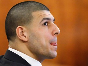Former New England Patriots football player Aaron Hernandez sits during his murder trial at Bristol County Superior Court in Fall River, Massachusetts, April 2, 2015. (REUTERS)
