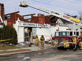 Sarnia firefighters were still on scene outside Playfair Music recording studio Monday morning, after a fire tore through the Mitton Street South building. Firefighters were able to keep the fire from spreading to neighbouring houses. (TYLER KULA, The Observer)