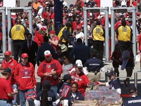 Fans stream through newly installed metal detectors at Nationals Park prior to the Washington Nationals Opening Day game againt the New York Mets at Nationals Park on April 6, 2015 in Washington, DC. (Win McNamee/Getty Images/AFP)