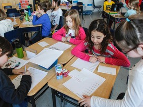 Cassidy Pilutti's Grade 3 French immersion class at Ecole Sir John A. Macdonald Public School is participating in their second Mystery Skype challenge in Kingston Students have to work as a team to generate questions and research the answers to determine the mystery location of the other class before they figure out where the local Grade 3 class is location. (Julia McKay/The Whig-Standard)