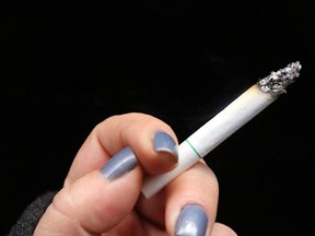 A woman holds a menthol cigarette. (Toronto Sun files)