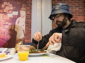 A man identified as Mr. Beards, enjoys the roast beef dinner on Easter Monday at the Ottawa Mission. April 6, 2015. 
Errol McGihon/Ottawa Sun/QMI Agency
