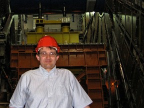 University of Alberta physicist Roger Moore stands at the Large Hadron Collider at Europe's physics research centre, the European Organization for Nuclear Research (CERN) in Geneva, Switzerland. SUPPLIED PHOTO/University of Alberta