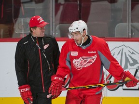 Red Wings head coach Mike Babcock (left) speaks to forward Pavel Datsyuk during practice in Montreal last October. (Ben Pelosse/QMI Agency/Files)