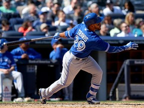 Blue Jays’ Devon Travis hits a solo home run in the seventh inning against the Yankees on Monday in New York. He didn’t admire the first round-tripper of his MLB career, however. “I just started running.” (AFP/PHOTO)