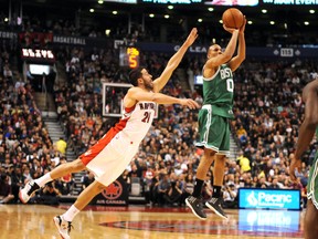 Raptors’ Greivis Vasquez is a little late blocking a shot from the Celtics’ Avery Bradley. (USA TODAY)