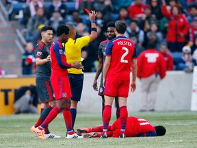 Toronto FC's Warren Creavalle is sent off after seeing a red card against Chicago on Saturday. (USA TODAY SPORTS)