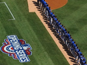 Blue Jays stand for the Canadian national anthem before their opening day game against New York at Yankee Stadium on Monday.  (Getty Images/AFP)