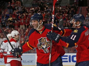 Jonathan Huberdeau #11 congratulates Jaromir Jagr #68 of the Florida Panthers as he celebrates after scoring a second period goal against the Carolina Hurricanes at the BB&T Center on April 2, 2015 in Sunrise, Florida. (Joel Auerbach/Getty Images/AFP)