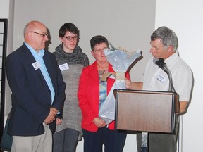 Submitted photo: Stephen, Sharon, and Brenda Benishek receive the Friend in Nature award at the Sydenham Field Naturalists 30th annual banquet held on April 1. The Benisheks received the award due to their efforts in restoring 100 acres of wetlands and tall grass prairie in Chatham-Kent.