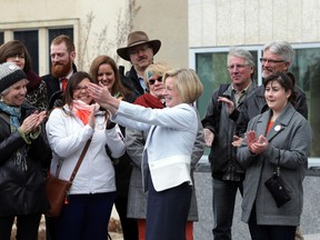 Alberta New Democratic Party Leader Rachel Notley cheers on her NDP candidates afer speaking to the media in front of the Alberta Legislature in Edmonton, Alberta on Friday, March 27, 2015. The PC party announced a spring election earlier in the day. Perry Mah/Edmonton Sun