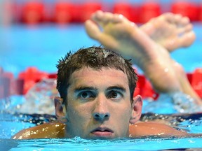 In this June 29, 2012 file photo, US swimmer Michael Phelps makes his way out of the pool following his first place finish in Heat 12 of the men's 200M Individual Medley at the 2012 US Olympic Team Trials in Omaha, Nebraska.  (AFP PHOTO/Frederic J. BROWN / FILES)