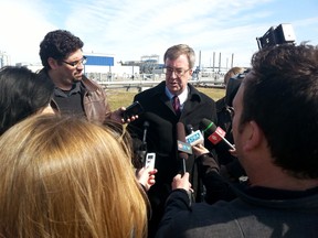 Mayor Jim Watson answers questions at the Robert O. Pickard Environmental Centre after the feds announced money for a sewage tunnel on Tuesday, April 7, 2015. JON WILLING/OTTAWA SUN.
