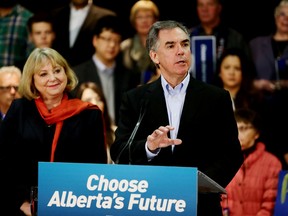 With his wife Karen at his side, Alberta premier Jim Prentice announces a provincial election in front of a supportive crowd in Edmonton, Alta., Tuesday, April 7, 2015. Perry Mah/Edmonton Sun/QMI Agency