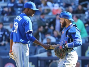Jays reliever Miguel Castro is congratulated by Russell Martin after Monday’s game in New York. (USA TODAY SPORTS)