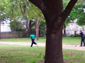 North Charleston police officer Michael Slager, right, is seen allegedly shooting 50-year-old Walter Scott in the back as he runs away, in this still image from video in North Charleston, S.C., taken April 4, 2015. (REUTERS/HANDOUT via Reuters)