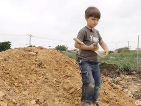 A four-year-old Texas boy stumbled upon a 100-million-year-old dinosaur bone while fish fossil hunting with his dad at a mall construction site, reports say.
(Screenshot from YouTube)