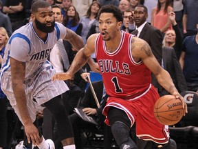 Chicago Bulls guard Derrick Rose (1) drives past Orlando Magic forward Kyle O'Quinn (2) during the fourth quarter of an NBA basketball game at Amway Center. (Reinhold Matay-USA TODAY Sports)