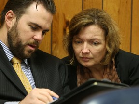 Attorney Michael James Corey sits with Roxanne Dube, mother of Marc Wabafiyebazu in juvenile court Wednesday April 8, 2015 in Miami, Fla. Dube is Canada's General Consul in Miami, and her son, Marc Wabafiyebazu has been charged with murder. Walter Michot/Miami Herald