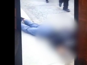 A screengrab from the video after the teenage victim was knocked unconscious.