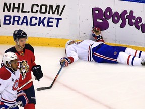 Montreal Canadiens left wing Max Pacioretty lays on the ice after being injured in the first period of a game against the Florida Panthers at BB&T Center on April 5, 2015. (Robert Mayer/USA TODAY Sports)