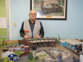 JESSICA LAWS/ FOR THE INTELLIGENCER
Stephen Fleck, president of the Belleville Model Railroad Club, stands with one of the club’s highly-detailed displays. The club will have its annual open house Saturday at the Bayview Mall.
